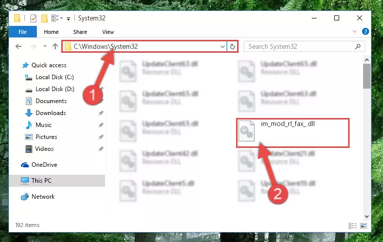 Pasting the Im_mod_rl_fax_.dll library into the Windows/System32 directory