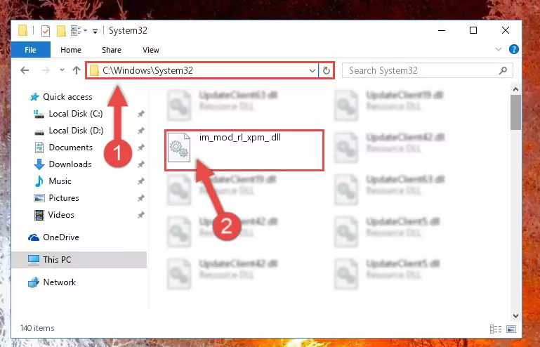 Pasting the Im_mod_rl_xpm_.dll file into the Windows/System32 folder