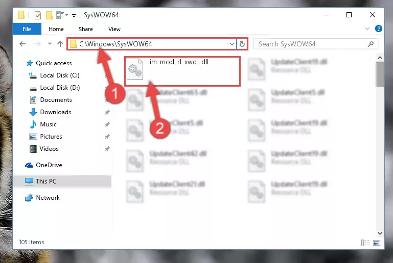 Pasting the Im_mod_rl_xwd_.dll file into the Windows/sysWOW64 folder