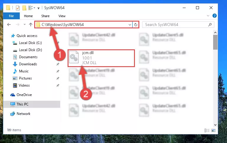 Pasting the Jcm.dll file into the Windows/sysWOW64 folder