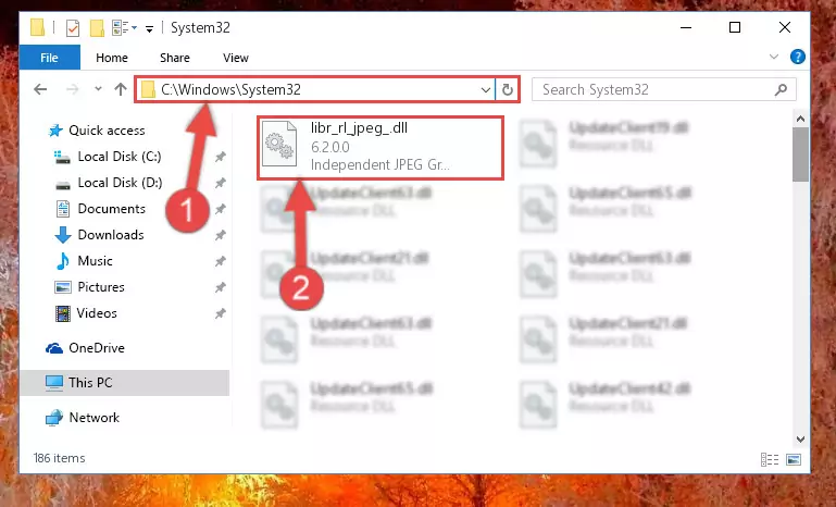 Pasting the Libr_rl_jpeg_.dll library into the Windows/System32 directory