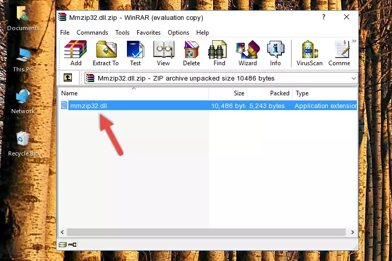 Pasting the Mmzip32.dll file into the software's file folder